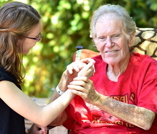 Volunteer comforting dementia patient