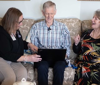 Patient Eamon Treanor and his wife Pat, with social worker, Callie Dettinger watching video