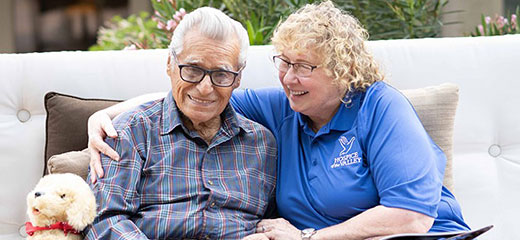 Dementia activities coordinator Gail Higginbotham, CNA, with patient Feliciano Ordonez.