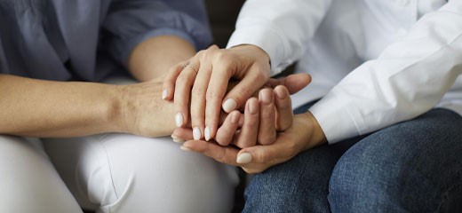 Two people holding hands