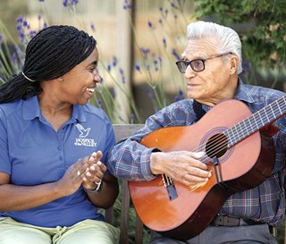 Feliciano Ordonez Gutierrez playing guitar to CNA Danae Holt