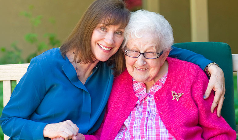 Dr. Maribeth Gallagher, director HOV's Dementia Program visits with dementia patient Sue Crawford, 100, at Gardiner Home.