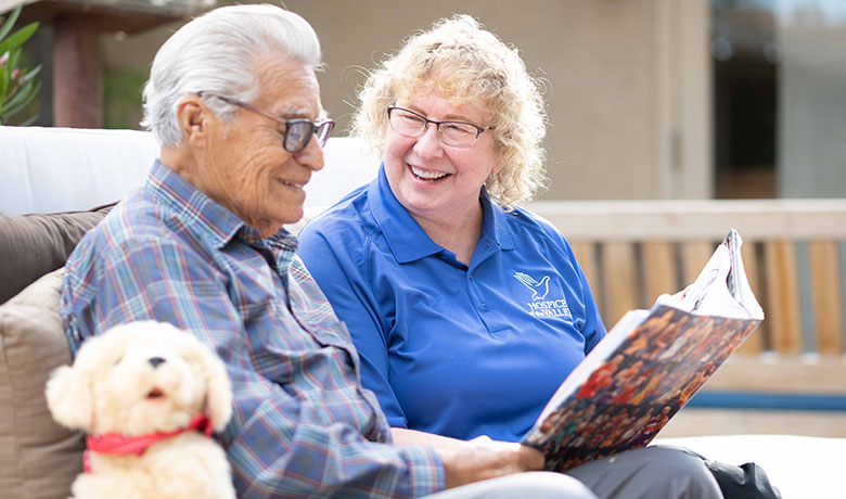 Dementia activities coordinator Gail Higginbotham, CNA, with patient Feliciano Ordonez
