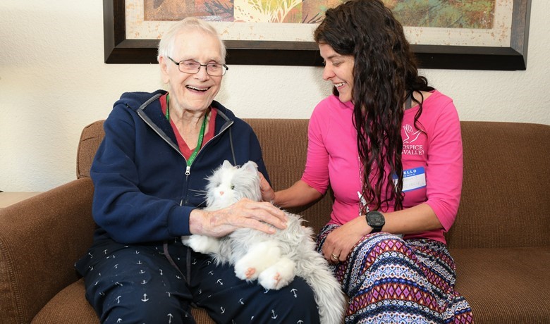 Patient playing with mechanical cat